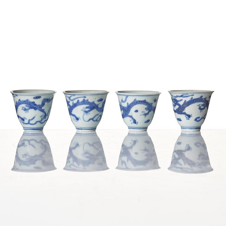 A set of four blue and white dragon wine cups, 'Hatcher Cargo', 17th century.