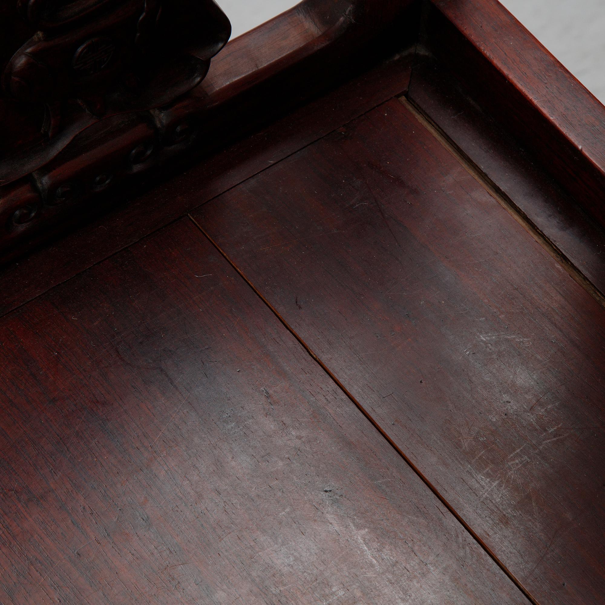 A pair of Chinese hardwood armchairs, presumably late Qing dynasty 19th century.