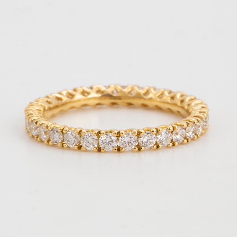 Brilliant-cut diamond eternity ring.