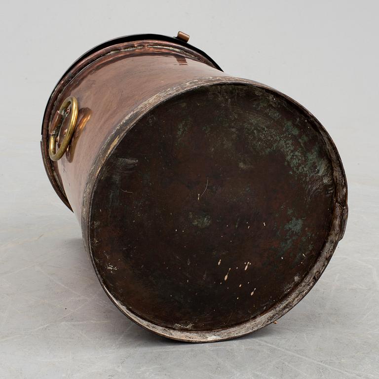 A copper water container, around the year 1900.