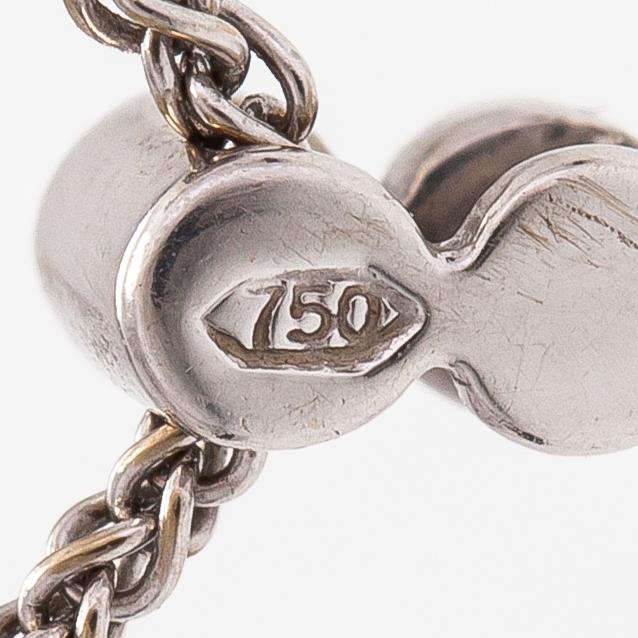 An 18K white gold necklace with a tanzanite and diamonds ca. 0.06 ct in total.