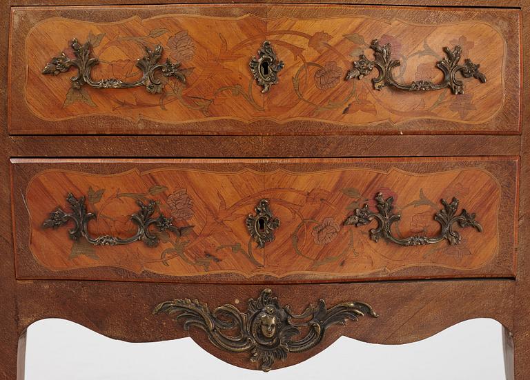 A Louis XV-style marquetry commode, first part of the 20th century.