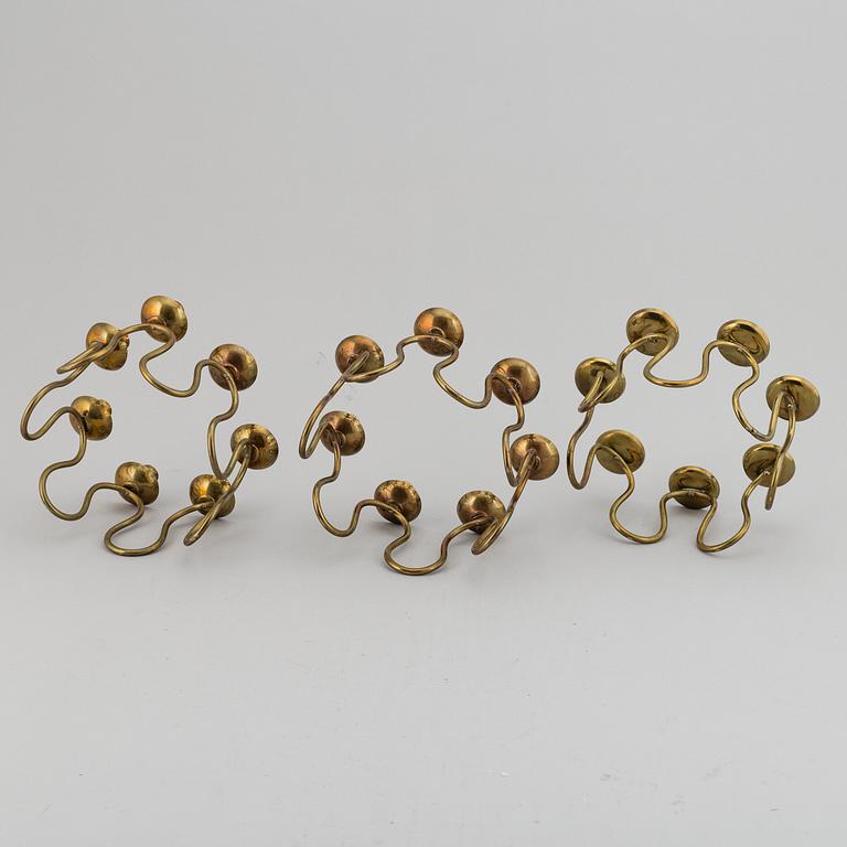 LARS HOLMSTRÖM, Three brass candelabra, Arvika, mid 20th Century.