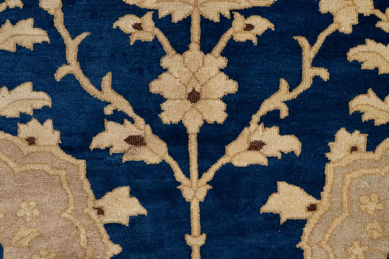 An antique Peking carpet, north China, c. 438 x 373 cm.