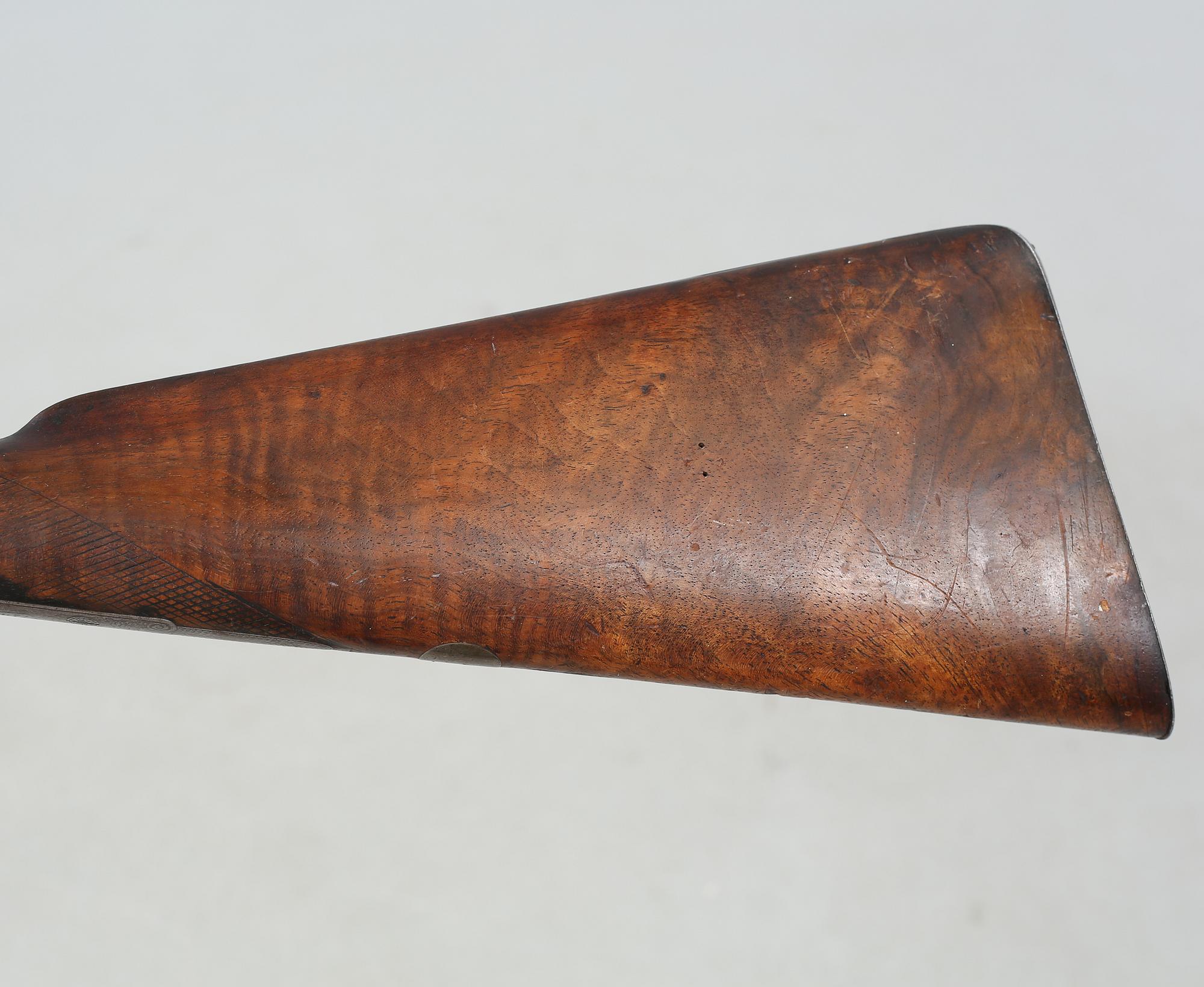 A percussion rifle by Charles William Lanchester in London, around the mid 19th century.