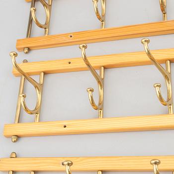 A set of three 'Dekorativ' coat hangers, Skoglunds metallgjuteri, Anderstorp, mid-20th century.