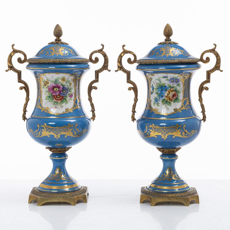 Decorative urns, a pair, porcelain, Sevres-like mark, circa 1900.