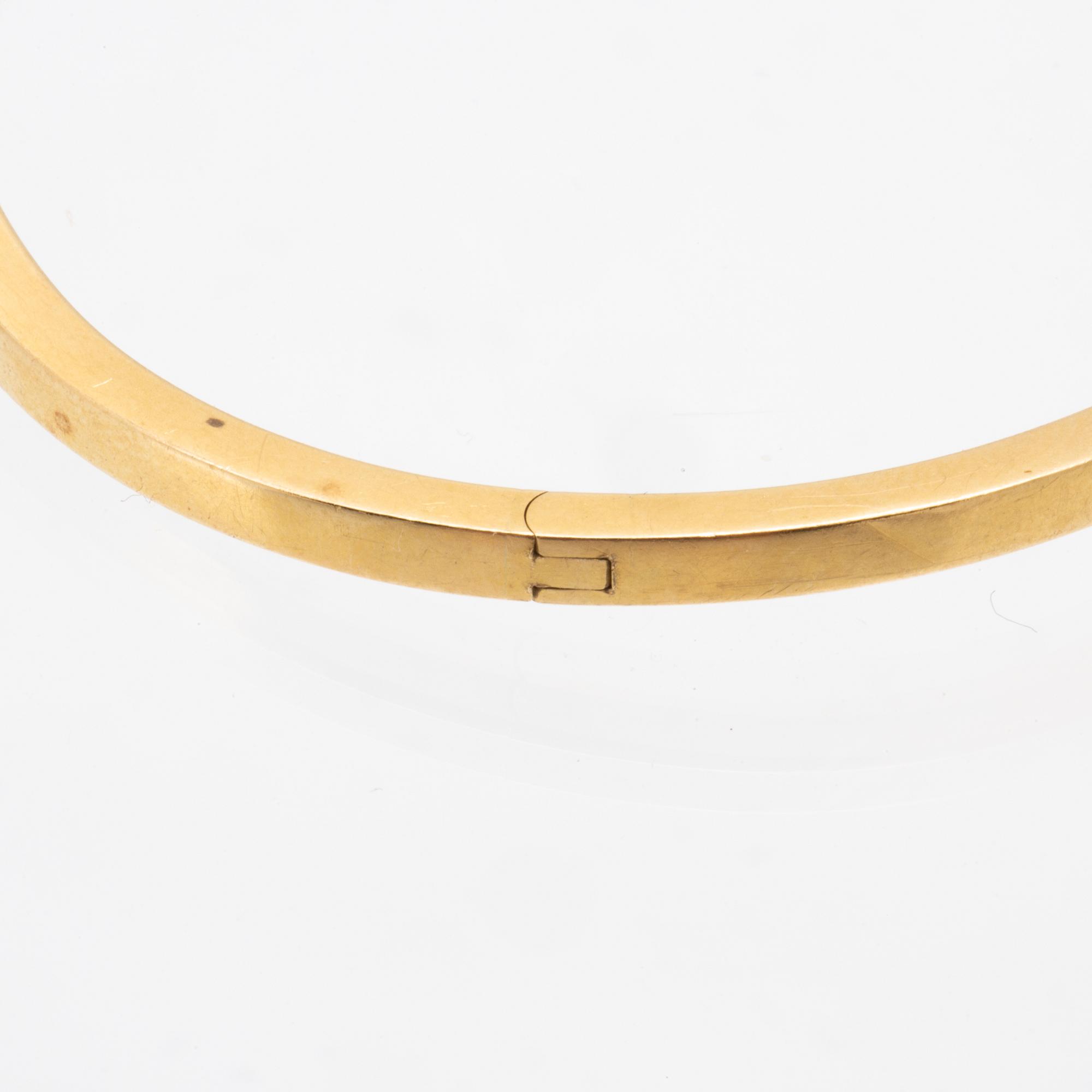 An 18K gold bracelet.