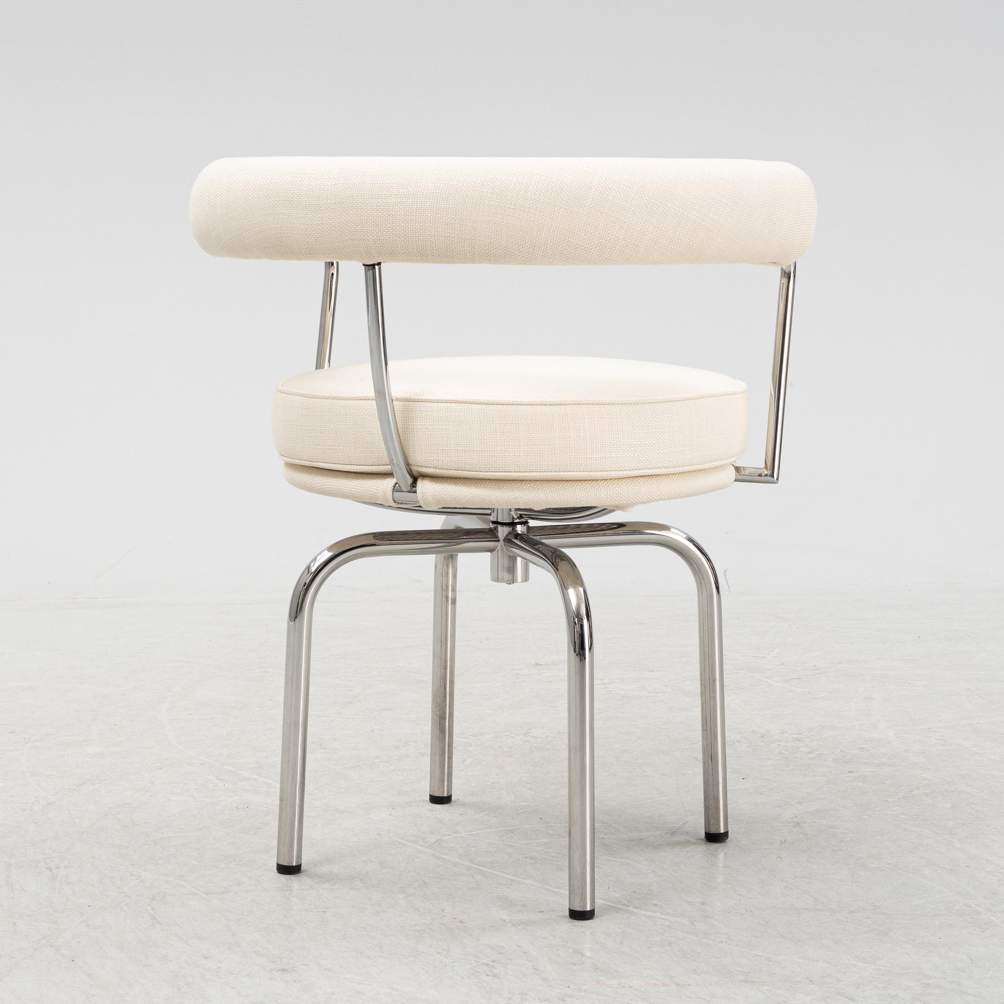 A LC 7 swivel chair by Charlotte Perriand & Pierre Jeanneret & Le Corbusier for Cassina, designed in 1927.