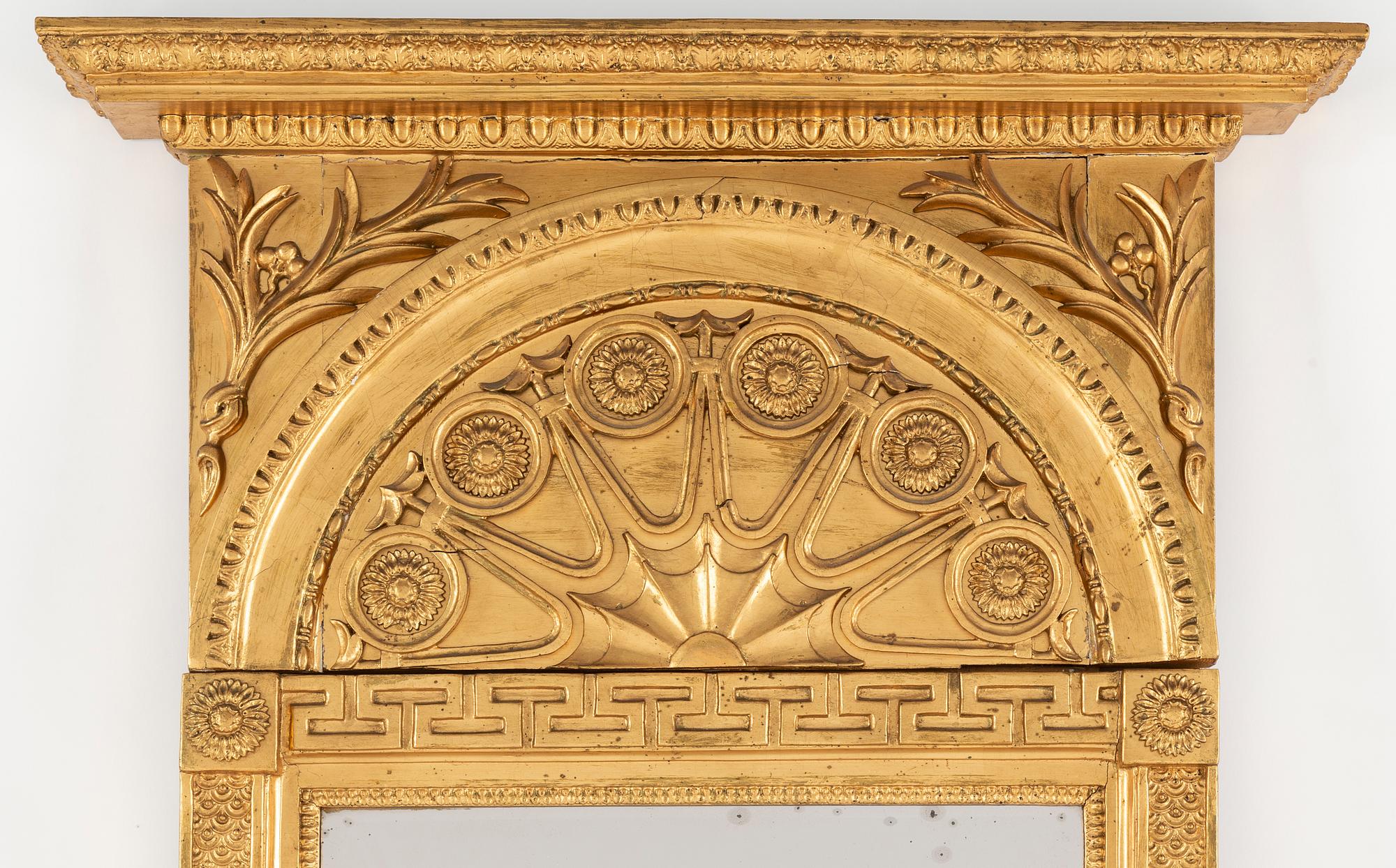 A Swedish Empire mirror, early 19th century.