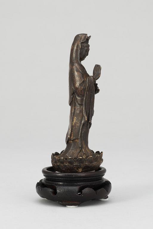 A Chinese 18th century bronze figure of Guanyin.