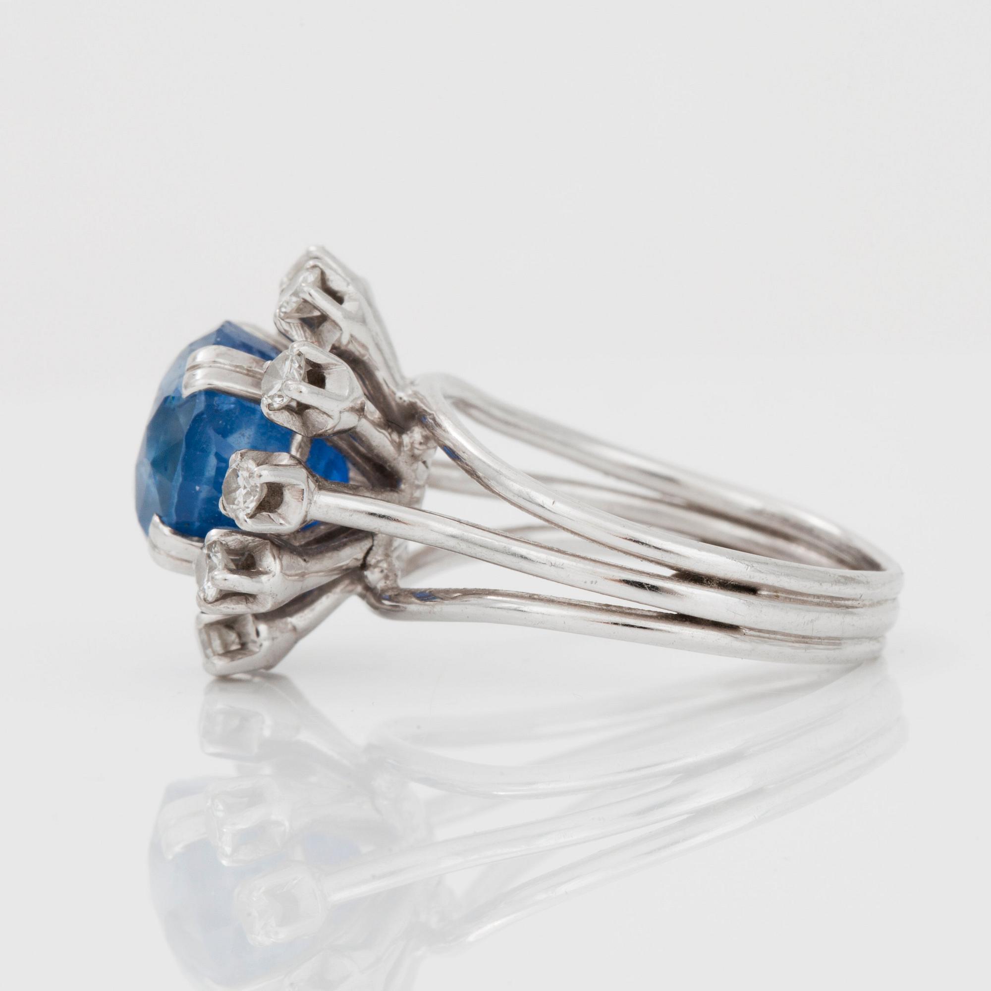 A sapphire and brilliant-cut diamond ring.