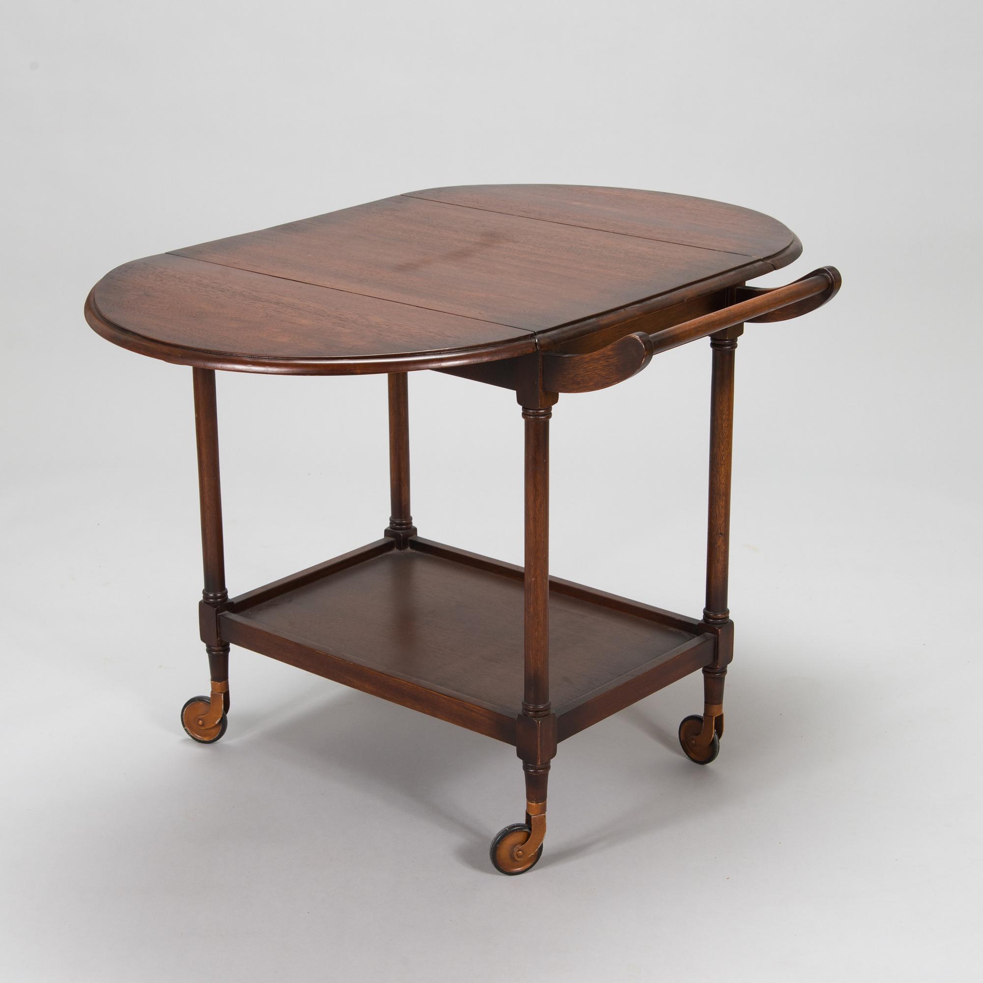 A drop-leaf tea trolley from the latter half of the 20th century.