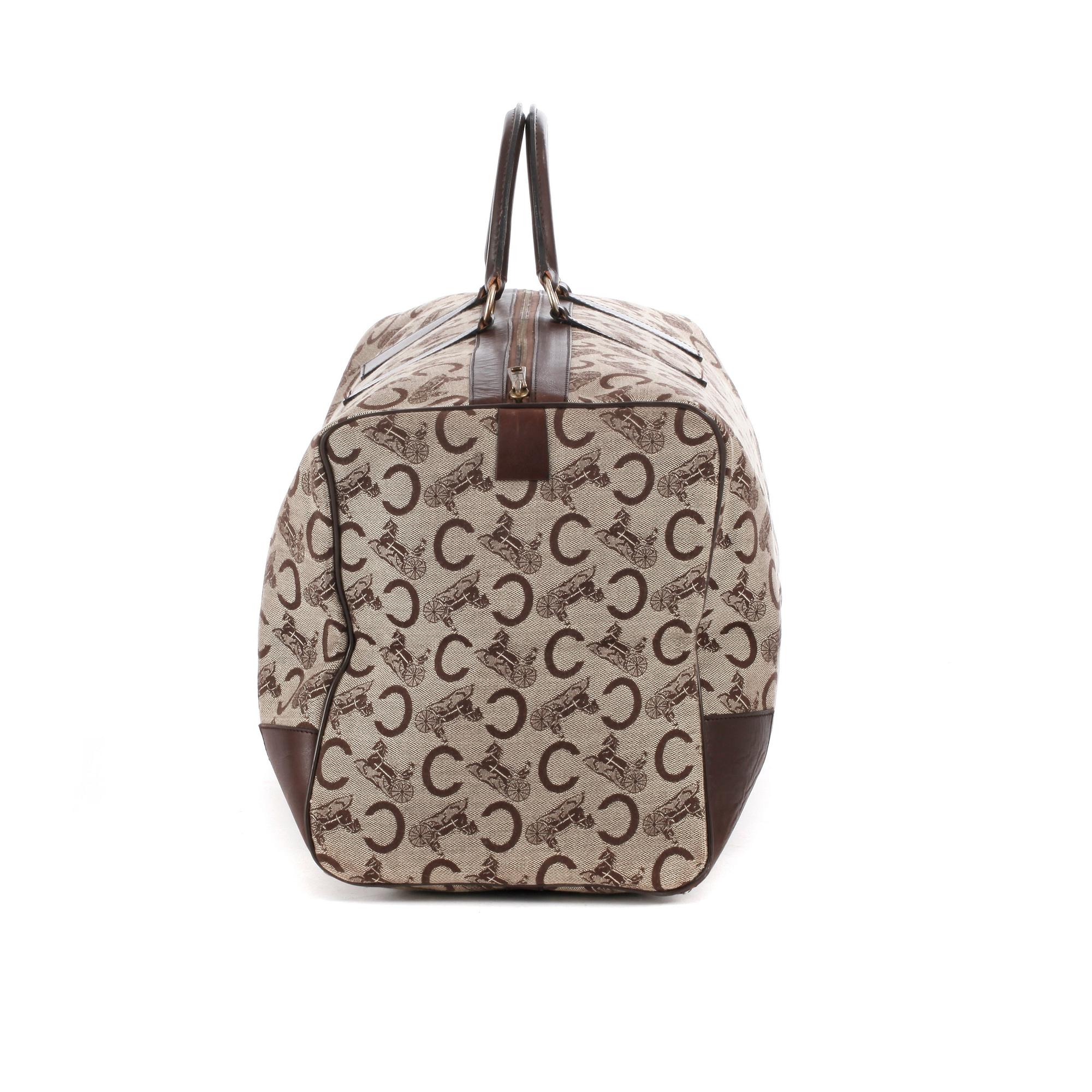 CÉLINE, a monogram canvas weekend bag.