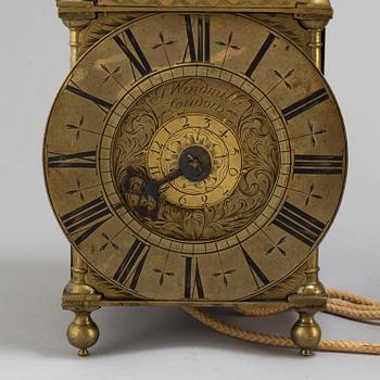 A late 17th or early 18th century lantern clock signed J Windmills London.