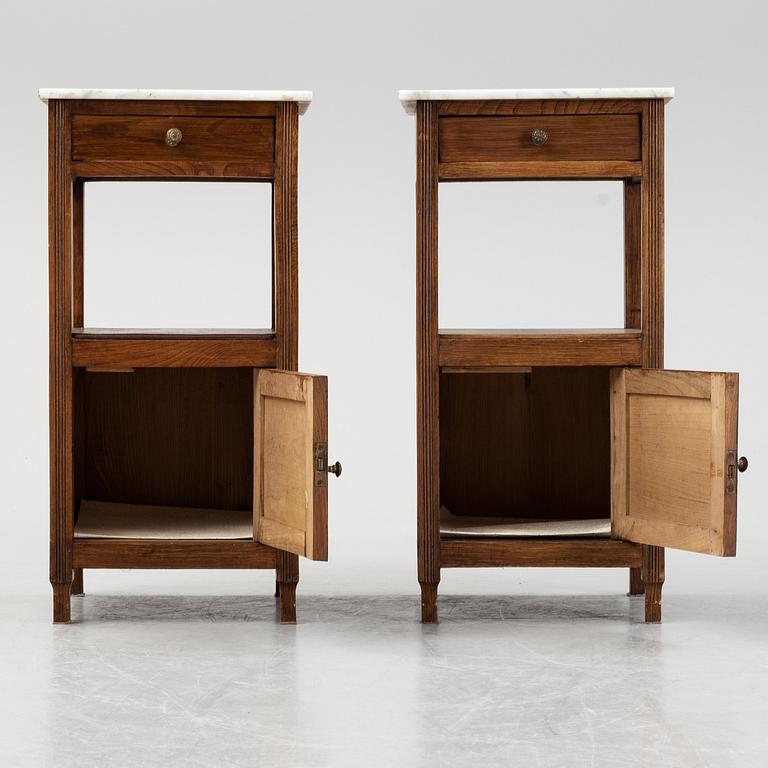 A pair of early 20th Century bedside tables.