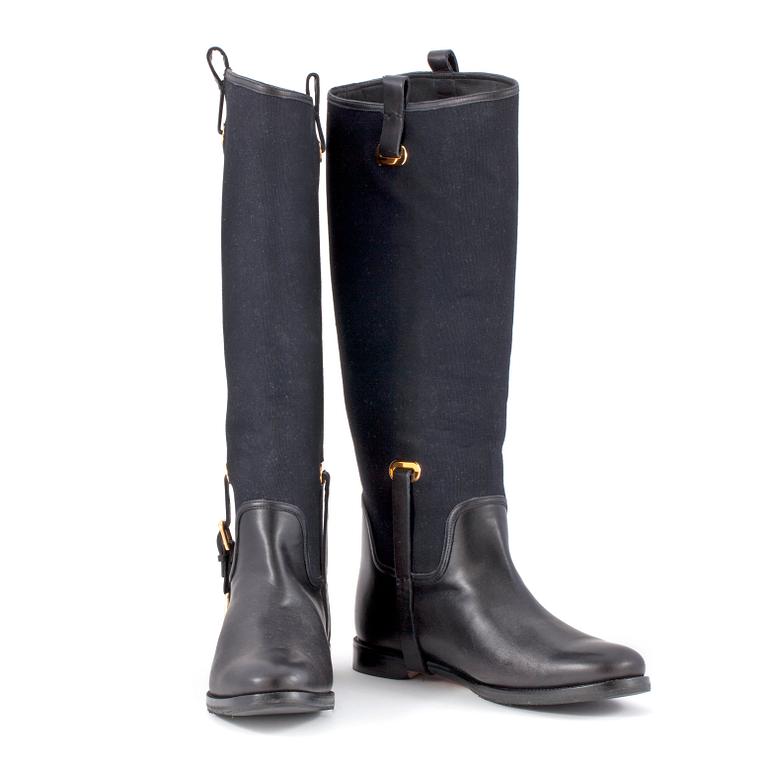 RALPH LAUREN, a pair of black canvas and leather boots. Size US 8.
