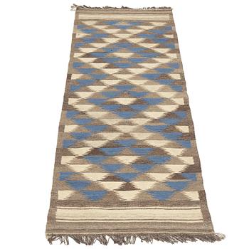 A persian kilim runner, c 250 x 74 cm.