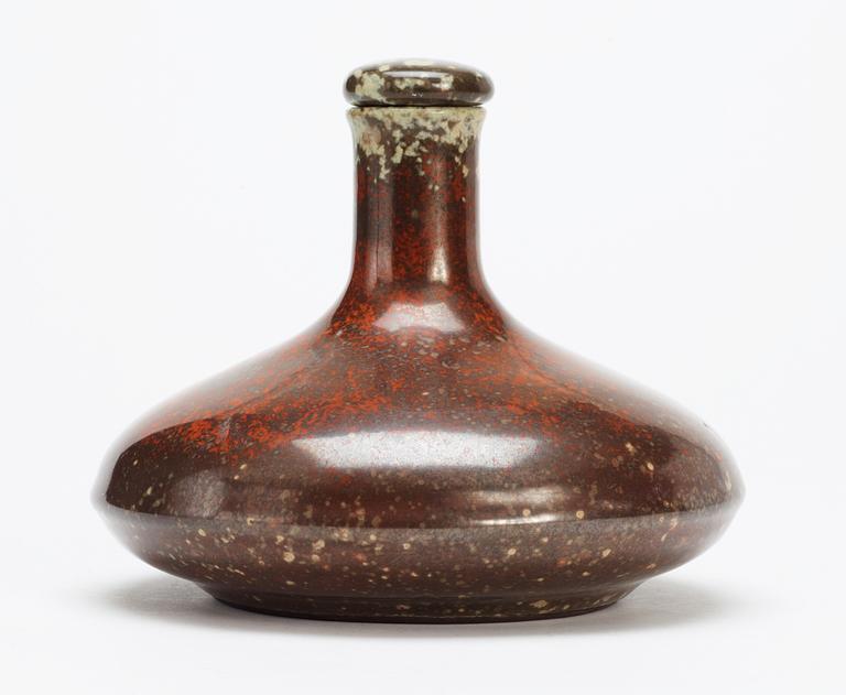 A Hans Hedberg faience bottle with stopper.