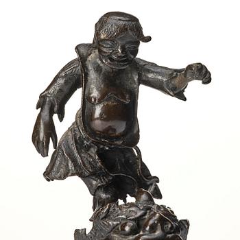 A bronze censer and cover in the shape of  Liu Haichan on the three legged toad, Qing dynasty.