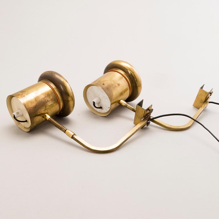 KAI RUOKONEN, A pair of brass wall lamps.