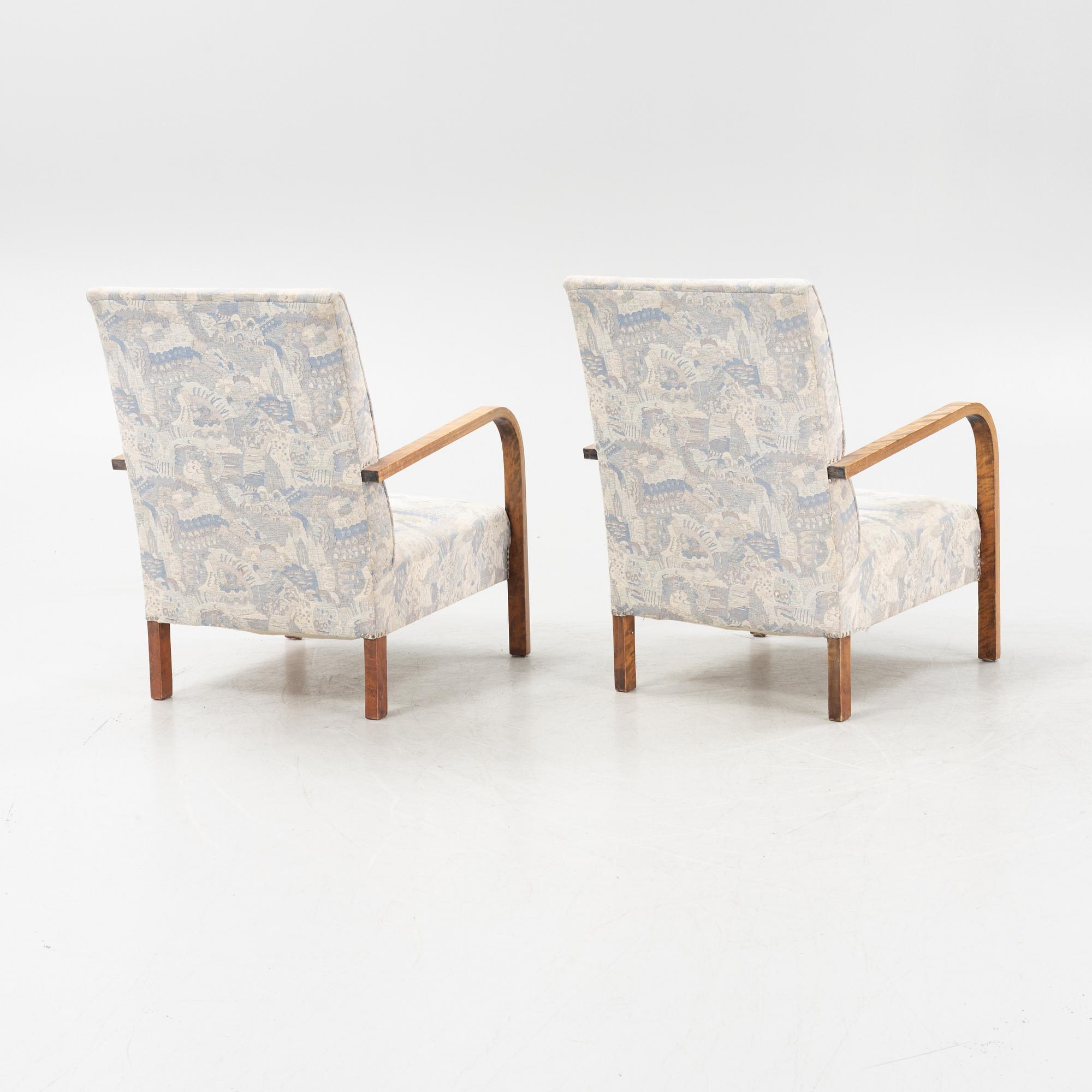 A pair of 1930's armchairs.
