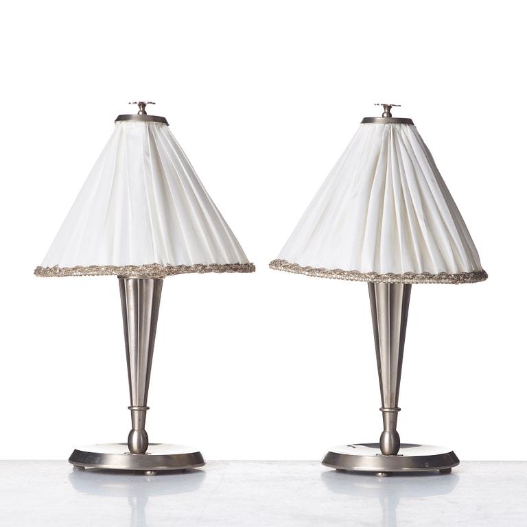 Harald Notini, HARALD ELOF NOTINI, a pair of pewter table lamps by Böhlmarks, Stockholm 1920's-30's.