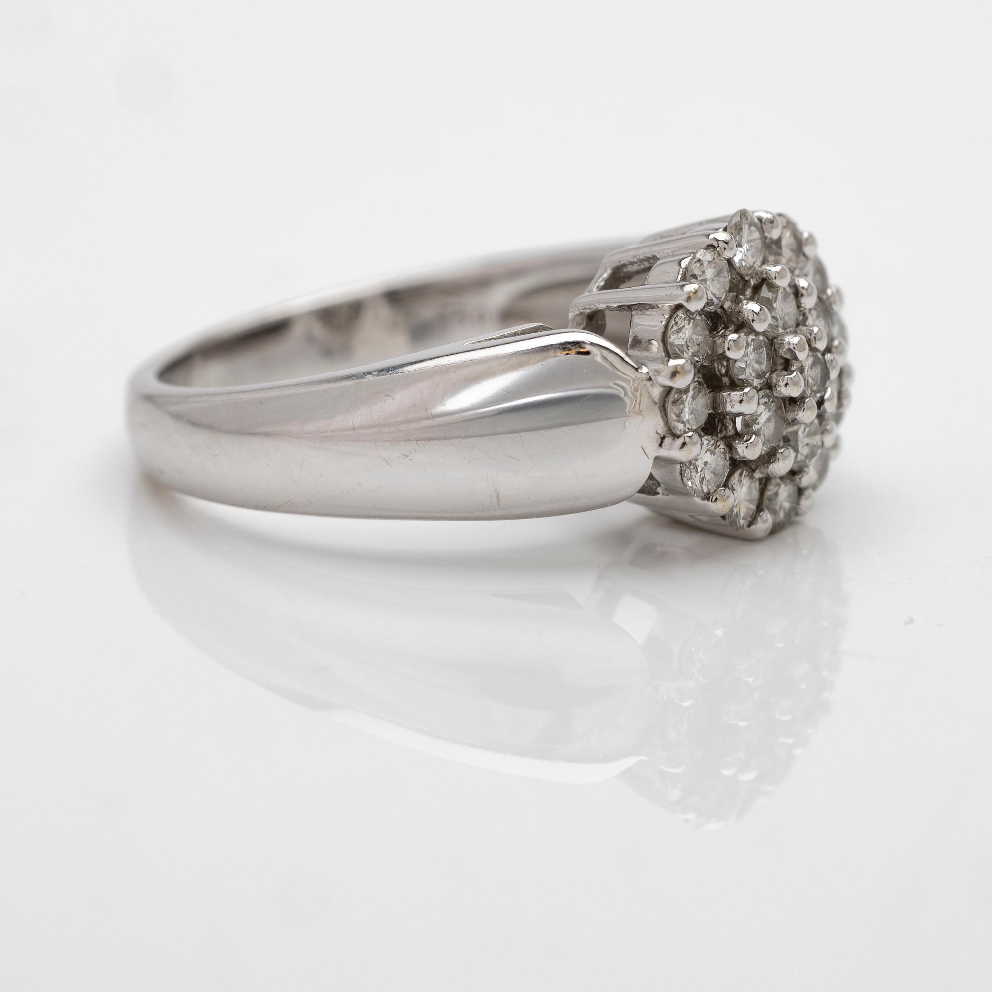 18K white gold ring with diamonds.