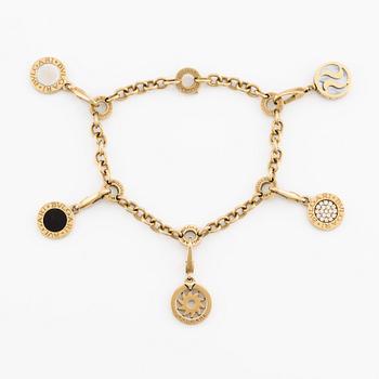 Bulgari, bracelet, with 5 charms (detachable), 18K gold, white gold, onyx, mother-of-pearl, and brilliant-cut diamonds.