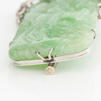 Brooch, platinum with carved jade and octagon-cut diamonds.