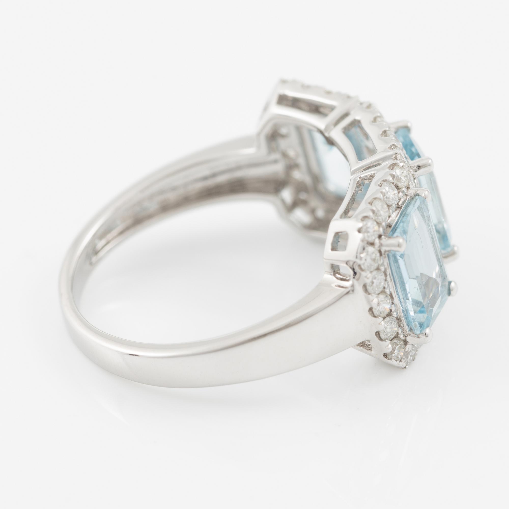 Ring in 18K white gold with three aquamarines and brilliant-cut diamonds.