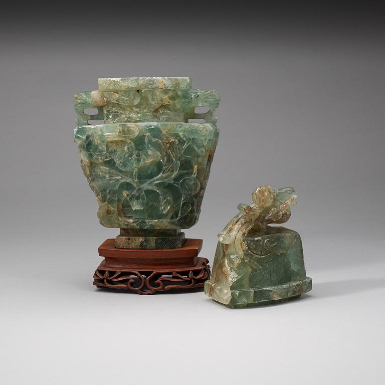 A Chinese carved fluorite vase with cover, 20th Century.