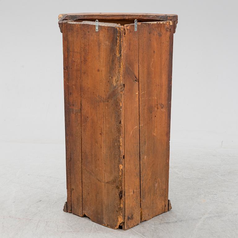 A painted corner cabinet, dated 1810.