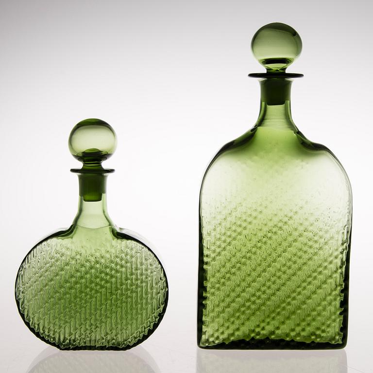 Two 'Flindari' glass carafes with stoppers from Riihimäen Lasi, in production 1964-68.