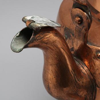 A coffee pot and a ladle in copper from the 19th century.
