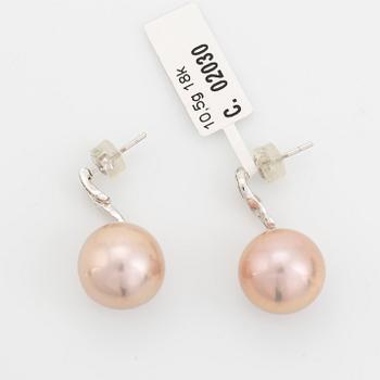 Pink freshwater pearl and baguette diamond earrings.