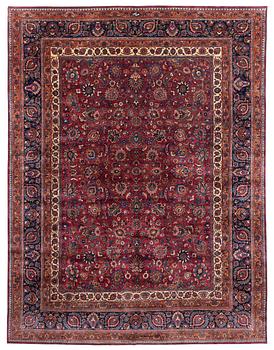 A Mashad carpet, signed Saber, c. 459 x 348 cm.