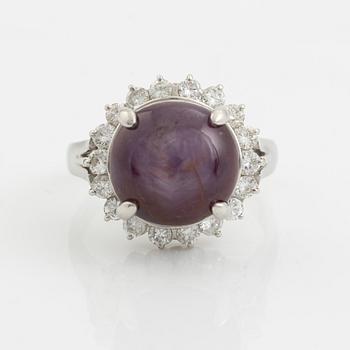 Purple star sapphire and brilliant cut diamond ring.