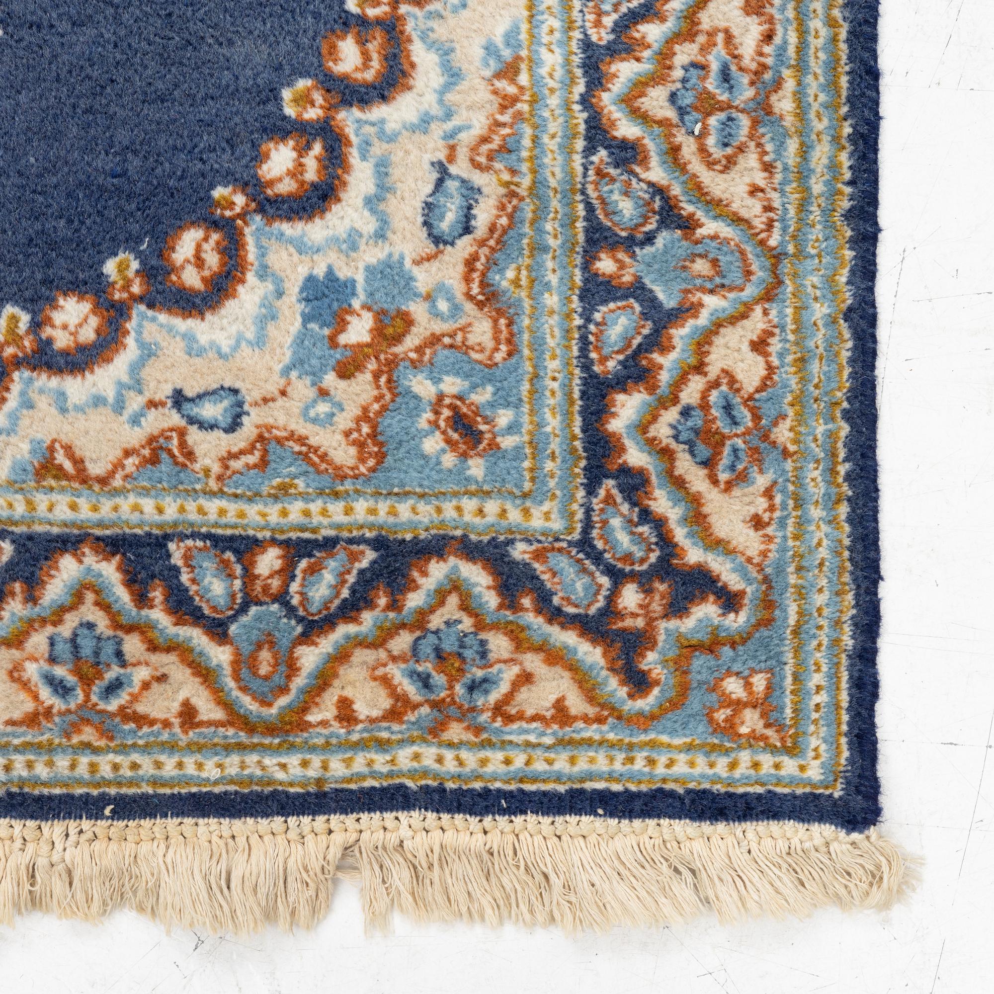 An old Kerman rug, ca. 130 x 91 cm.