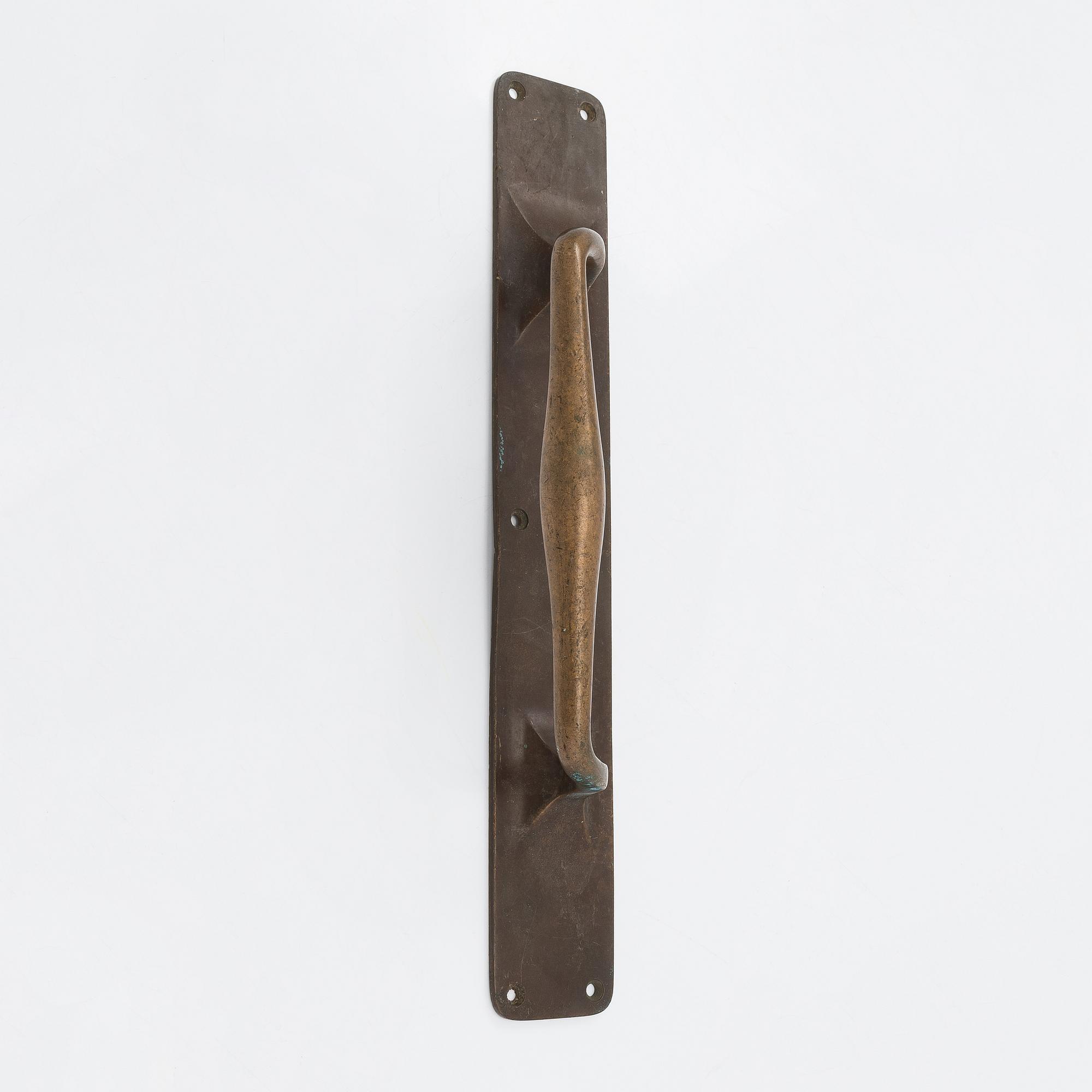 An Art Nouveau door handle from early 20th century.