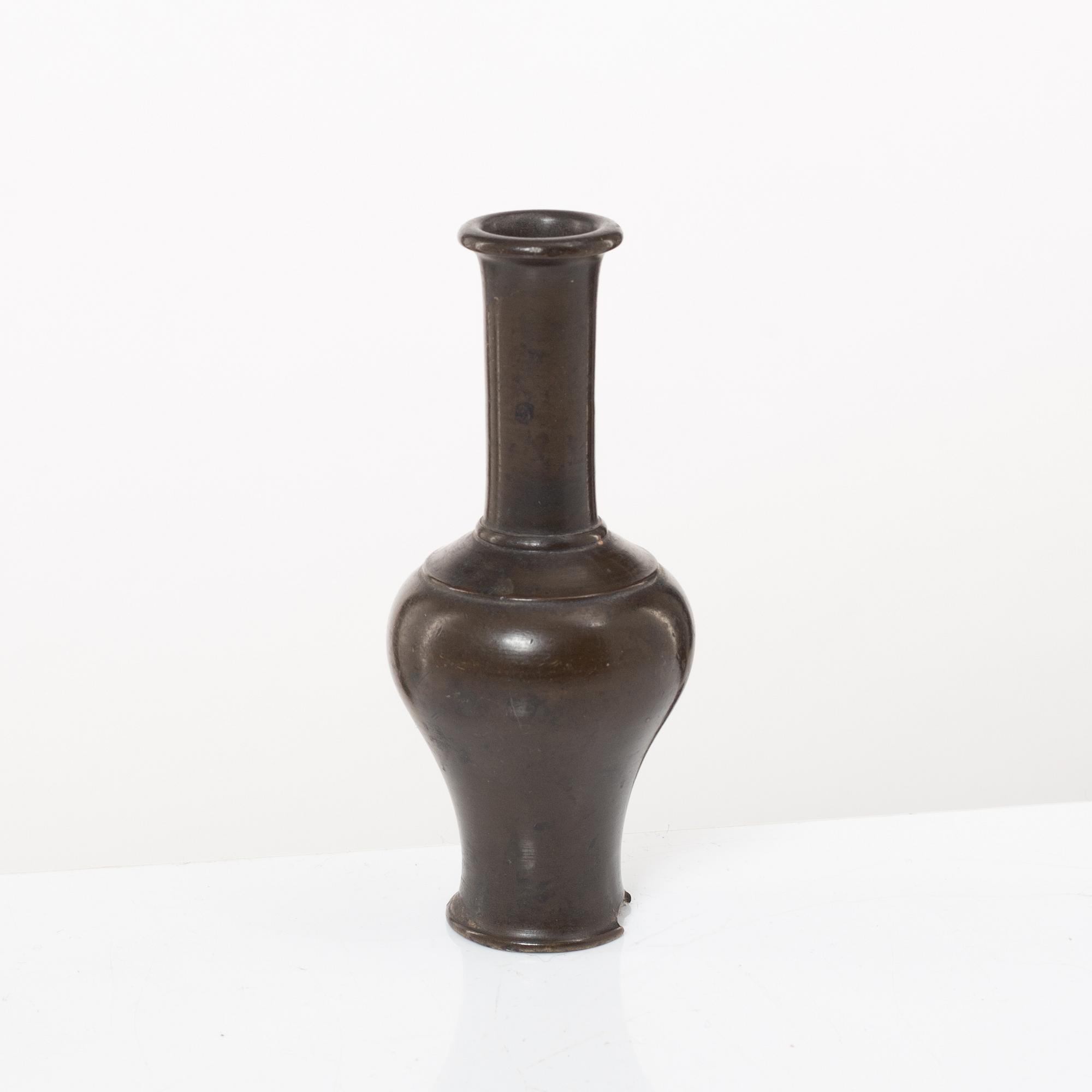 A Chinese bronze vase, joss stick holder and a bamboo brush pot, Qing dynasty.