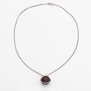 Kaija Aarikka, A necklace, a paid of earrings and a brooch made of silver and wood. Finland.