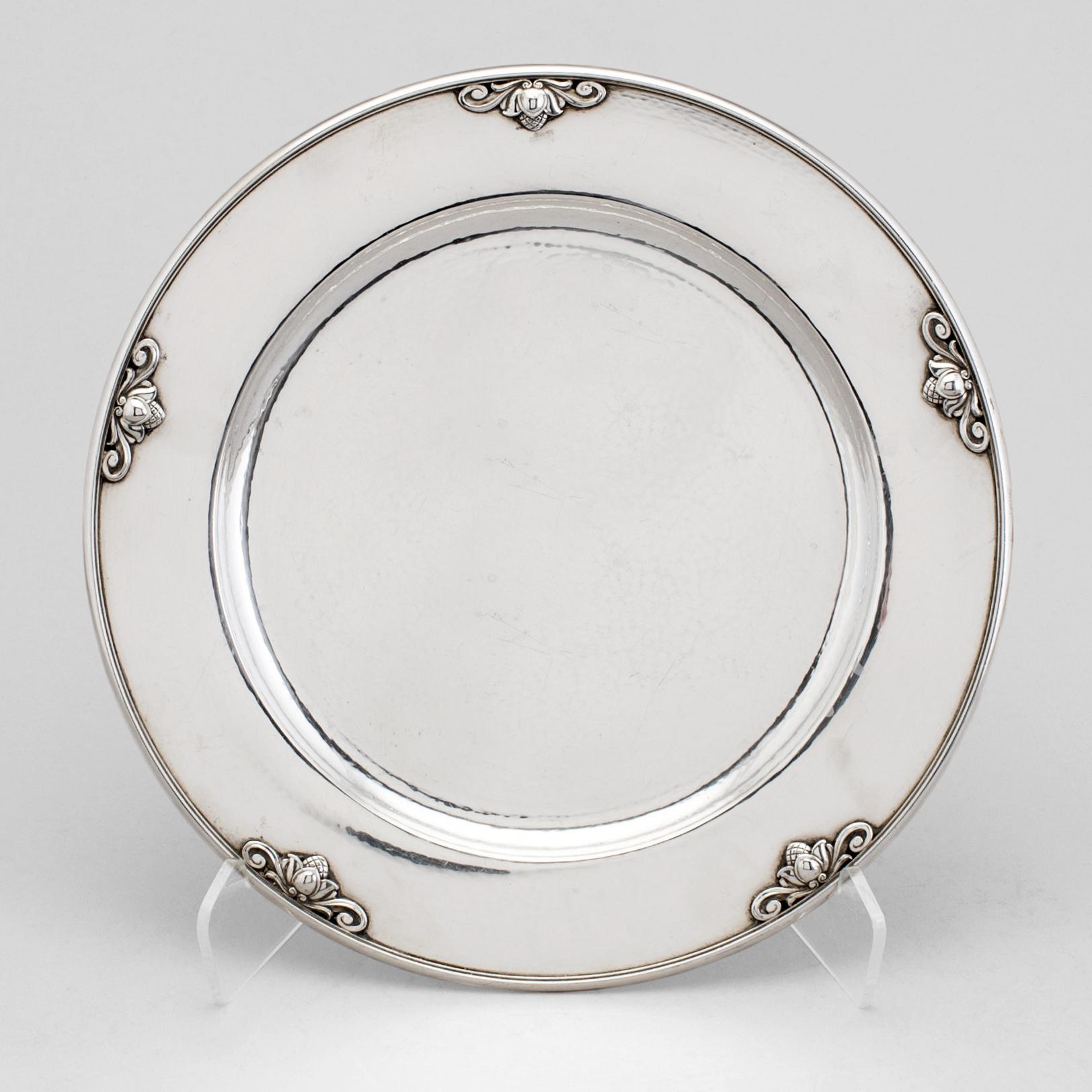 a sterling silver plate designed by Johan Rohde model Acorn 642A for Georg Jensen. After 1945. Weight ca 676 gram.