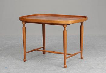 A Josef Frank mahogany table, Firma Svenskt Tenn.