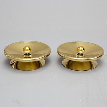 TOM DIXON, a pair of brass wall lamps.