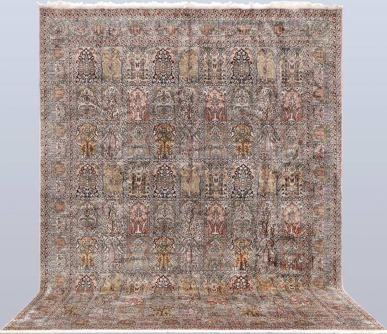 A Kashmir silk carpet, 418 x 297 cm.
