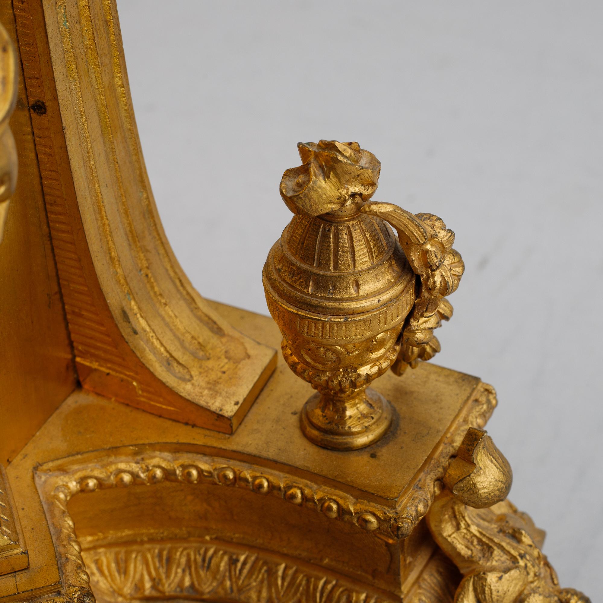 A French gilt bronze mantel clock from Henry Marc á Paris, second half of the 19th century.