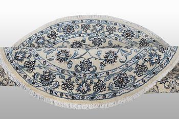 A rug, Nain, part silk, ca 316 x 136 cm.