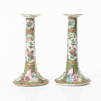A pair of famille rose Canton candle sticks, Qing dynasty, 19th century.