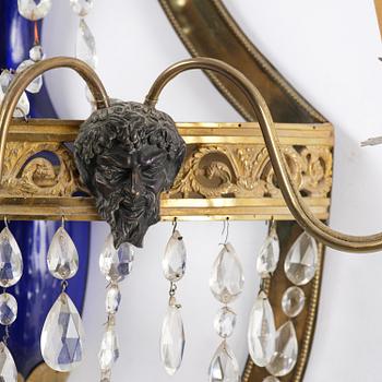 A pair of Russian Louis XVI-style  four-branch gilt bronze appliques, 19th century.
